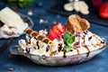 Homemade Banana Split with ice cream and chocolate.