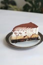 Homemade Banoffee Cake with caramel sauce, bananas and whipped cream on white table. Royalty Free Stock Photo