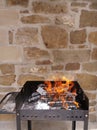 Homemade barbecue with firewood under beautiful orange flames