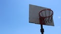 Old backboard with basketball hoop high in the sky Royalty Free Stock Photo