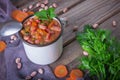 Homemade bean soup, carrots, onions and parsley