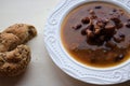 Homemade bean soup , vegetables ,bacon and spices. Detail of bowl of bean soup with large beans