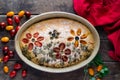 Homemade, beautiful and delicious, italian focaccia in round baking bowl. Decoration that looks like flowers in garden is made of Royalty Free Stock Photo