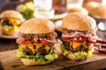 Homemade beef burger, caramelized onion, bacon and beer Royalty Free Stock Photo