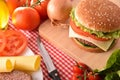 Homemade burger with ingredients on table elevated top Royalty Free Stock Photo