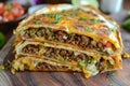 Homemade beef crunch wrap supreme. Supreme nachos cut in half and stacked on each other