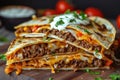Homemade beef crunch wrap supreme. Supreme nachos cut in half and stacked on each other