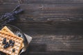 Homemade belgian waffles with blueberries on the dark wooden table with copy space Royalty Free Stock Photo