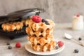 Homemade Belgian waffles with forest fruits, blueberries, raspberries and yogurt. Royalty Free Stock Photo