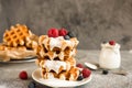 Homemade Belgian waffles with forest fruits, blueberries, raspberries and yogurt.