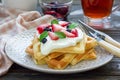 Homemade belgian waffles with yogurt, strawberry and blueberry, breakfast time Royalty Free Stock Photo