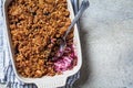 Homemade berry oat crumble pie in backing dish. Comfort food concept Royalty Free Stock Photo