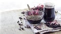 Homemade black elderberry syrup in glass bowl and jar Royalty Free Stock Photo