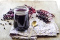 Homemade black elderberry syrup in glass jar Royalty Free Stock Photo