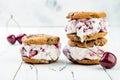 Homemade Black Forest roasted cherry ice cream sandwiches with chocolate chip cookies. Royalty Free Stock Photo