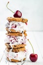 Homemade Black Forest roasted cherry ice cream sandwiches with chocolate chip cookies. Royalty Free Stock Photo