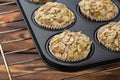 Homemade blueberry bran muffins with almond in bakeware