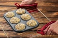 Homemade blueberry bran muffins with almond in bakeware