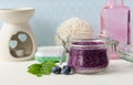 Homemade blueberry face and body sugar scrub, bath salts, foot soak in a glass jar. DIY cosmetics for natural skin care. Royalty Free Stock Photo