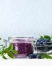 Homemade blueberry face and body sugar scrub/bath salts/foot soak in a glass jar. DIY cosmetics for natural skin care. Copy space. Royalty Free Stock Photo
