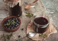 Blueberry jam in jar with berries and leaves over rustic wooden table Royalty Free Stock Photo