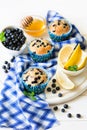 Homemade blueberry muffins with fresh berries, honey and lemon Royalty Free Stock Photo