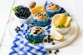 Homemade blueberry muffins with fresh berries, honey and lemon Royalty Free Stock Photo