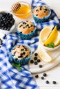 Homemade blueberry muffins with fresh berries, honey and lemon Royalty Free Stock Photo