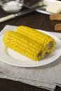 Homemade boiled corn on the wooden table. Royalty Free Stock Photo