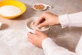 Homemade bread baking. closeup woman hands mixing ingredients for dough preparation in bright kitchen with marble countertop Royalty Free Stock Photo