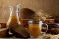 Homemade bread kvass. Summer carbonated soft drink. Glass and carafe on a wooden table. Black Overseas Rye Bread - Ingredients for Royalty Free Stock Photo