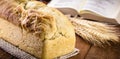 Homemade bread made in the Easter and Eucharist period, called Christ bread, religious symbol, with Bible and crucifix in the