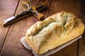 Homemade bread made in the Easter and Eucharist period, called Christ bread, religious symbol, with Bible and crucifix in the