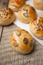 Homemade burger bun on bakery parchment . Food photography, concept of homemade fresh bakery. Rolls with sesame seeds hamburger wi Royalty Free Stock Photo