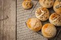 Homemade burger bun on bakery parchment . Food photography, concept of homemade fresh bakery. Rolls with sesame seeds hamburger Royalty Free Stock Photo
