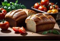 Homemade bread (rye and wheat) with tomatoes, healthy breakfast or snack on a wooden table, Royalty Free Stock Photo