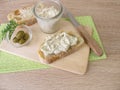 Bread spread of green olives and cream cheese on white bread