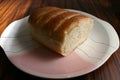 Homemade bread on traditional crockery plate on wooden background. Food present at breakfast in Brazil