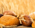 Homemade bread and wheat on the wooden table Royalty Free Stock Photo