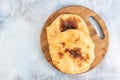 Homemade Bread On The Wooden Board Above Blue Background