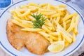 Homemade breaded chicken breast or Milanese chicken cutlet with tasty and crispy french fries