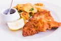 A Homemade Breaded German Weiner Schnitzel with cooked Potatoes