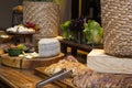 Homemade breads and assorted cheeses exposed on the wooden table Royalty Free Stock Photo