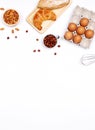 Homemade breads or bun, croissant and bakery ingredients, flour, almond nuts, hazelnuts, eggs on white background, Bakery Royalty Free Stock Photo