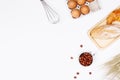 Homemade breads or bun, croissant and bakery ingredients, flour, almond nuts, hazelnuts, eggs on white background, Bakery Royalty Free Stock Photo