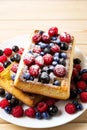 Homemade breakfast Belgian waffles with blueberry and raspberry