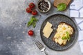 Homemade breakfast or brunch meal - scrambled eggs. Scrambled eggs on whole grain bread on a stone table. View from above. Copy Royalty Free Stock Photo