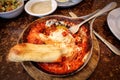 Homemade breakfast shakshuka of fried eggs with tomato sauce in Royalty Free Stock Photo