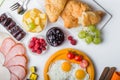 Homemade breakfast with sunny side up fried egg toast coffee fruits vegetable and orange juice in top view with copy space. Delici Royalty Free Stock Photo