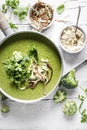 Homemade broccoli soup with horseradish and parsley chips